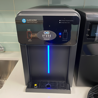 Water dispenser with blue light on a kitchen counter