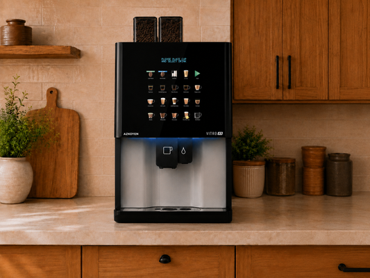 CAFFEIN8 bean-to-cup coffee machine with touchscreen drink menu and dual bean hoppers on a kitchen counter