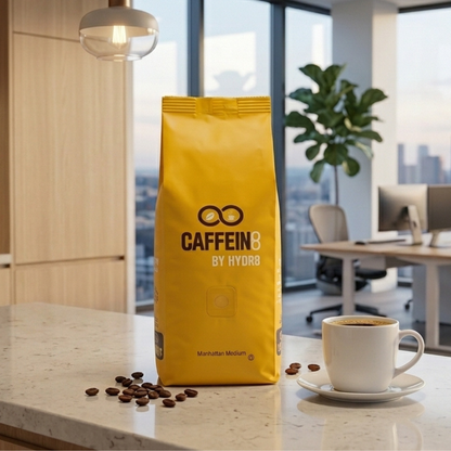 CAFFEIN8 by HYDR8 Manhattan Medium Roast coffee bag in modern office break room with brewed cup